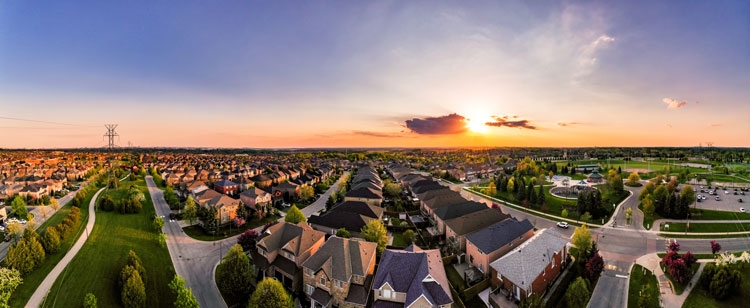 An aerial view of a neighbourhood at sunset